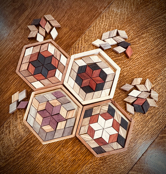 1K. Creativity Puzzle. Art Puzzle. Create your own designs with perfect parallelogram shapes in this puzzle. Exotic woods in 4 species. Make 27 piece designs in a hexagon. Comes with several spare pieces in each wood color.
