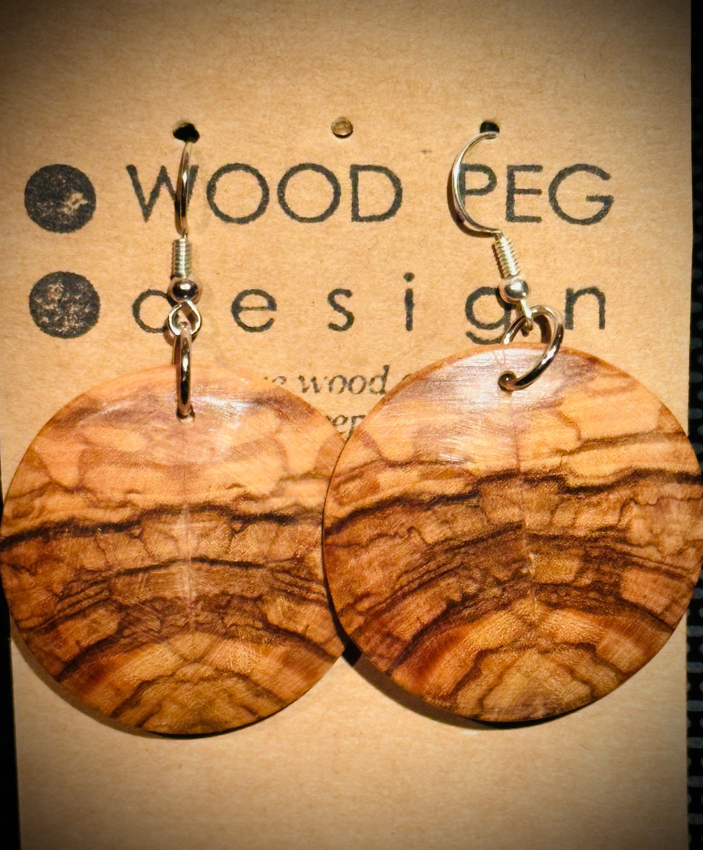 1A. Custom Earrings. Bookmatched Olivewood round earrings.