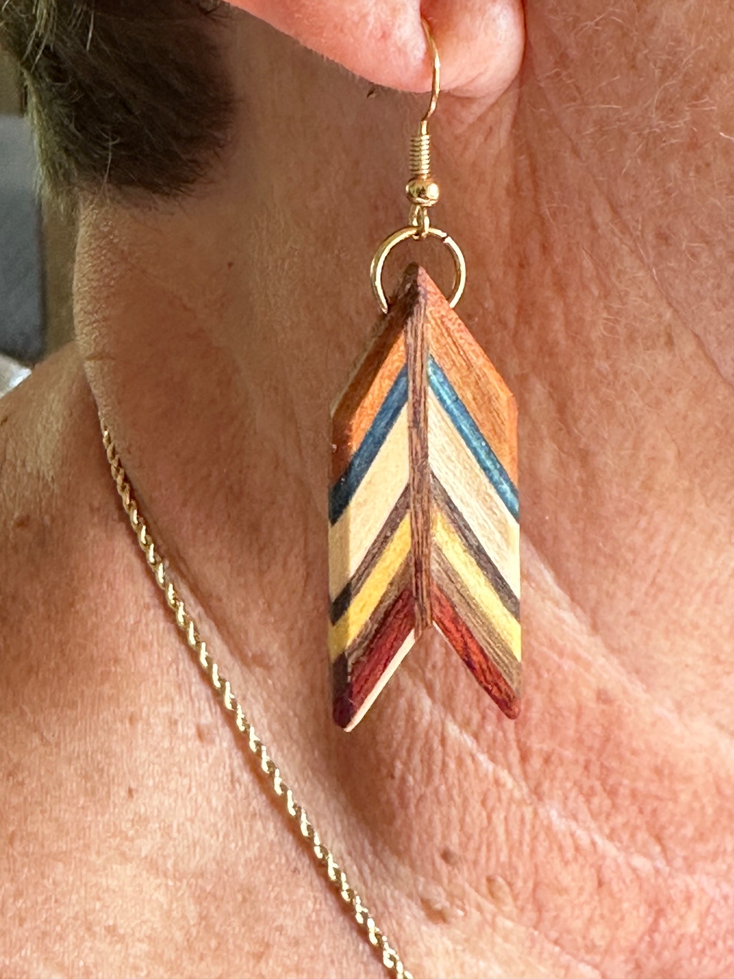 1E.  Custom earrings. Bookmatched Leaf and Arrow feathers.