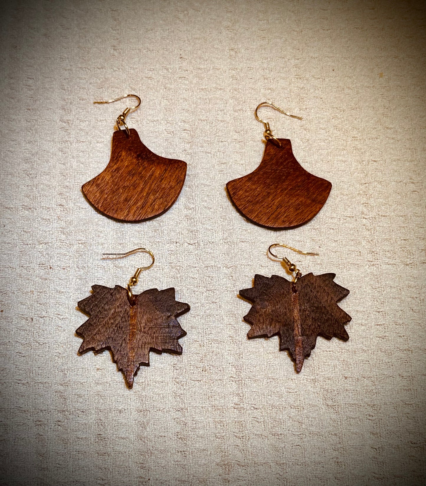 1E.  Custom earrings. Bookmatched Leaf and Arrow feathers.