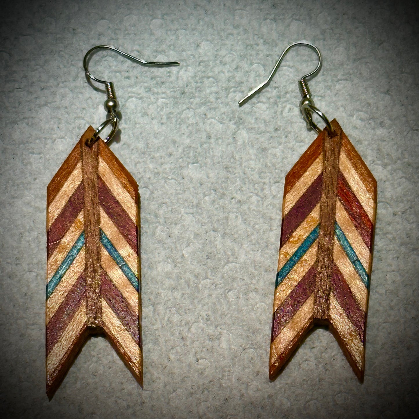 1E.  Custom earrings. Bookmatched Leaf and Arrow feathers.